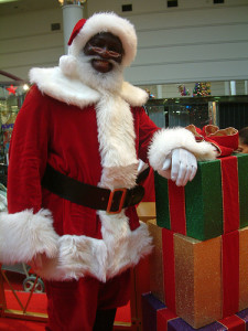 Black Santa and Presents by soulchristmas [CC BY 2.0], via Flickr