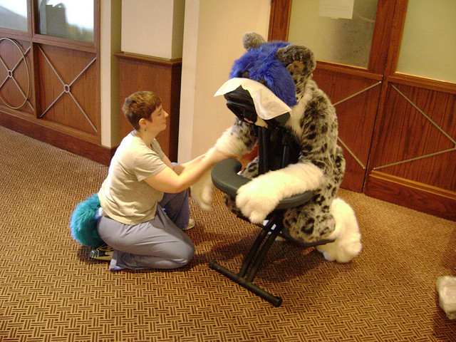 "A fursuiter gets a massage" by Douglas Muth [CC BY-SA 2.0 (https://creativecommons.org/licenses/by-sa/2.0/)], via Flickr