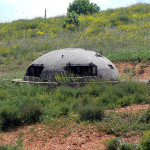 Photo of bunker on Albanian/Macedonian border by Fingalo (Own work) [CC BY-SA 2.0 de (http://creativecommons.org/licenses/by-sa/2.0/de/deed.en)], via Wikimedia Commons